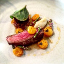 Aged beef, jus roasted tomatoes, tomato honey, fermented potato and Malabar spinach and flowers
