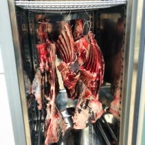 The cabinet of dry-ageing meats